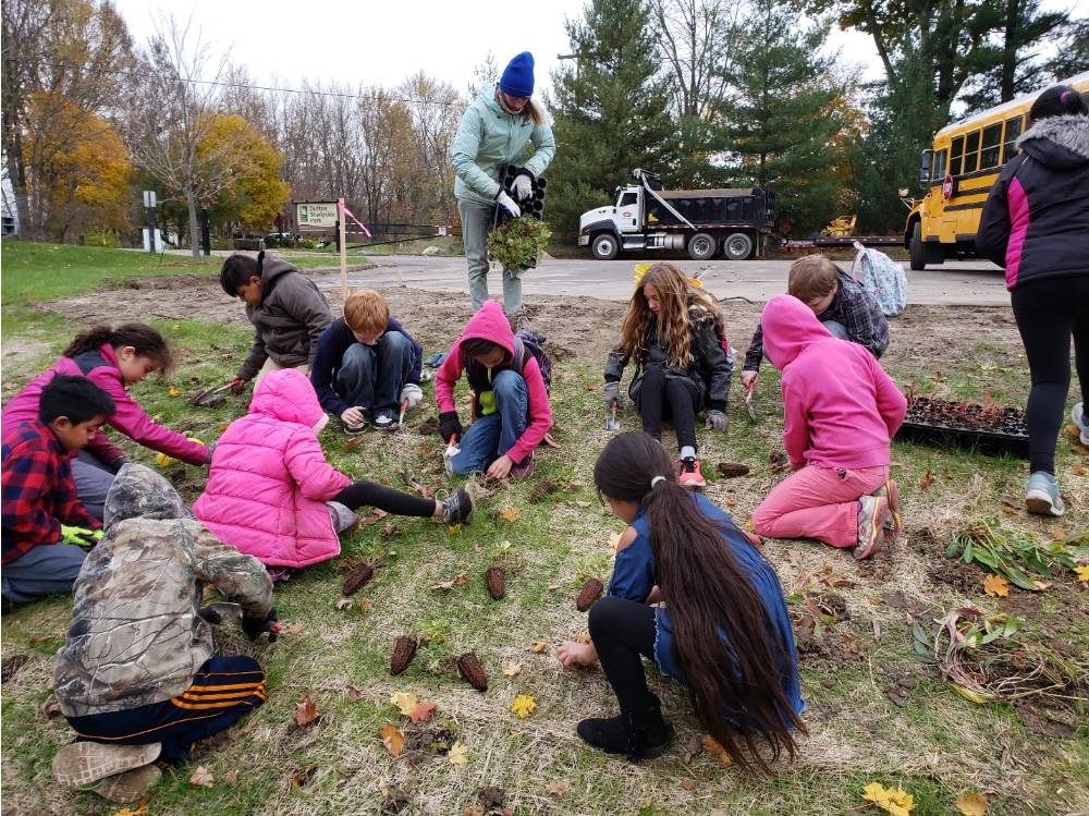 Lee Elementary students planting native plants